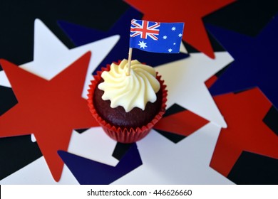 Happy Australia Day, Party Food With Red, White And Blue Cupcake And Australian Flag. Anzac Day. Celebration, Patriotism And Holidays Concept - Close Up Of Glazed Muffin Decorated With Australian Flag