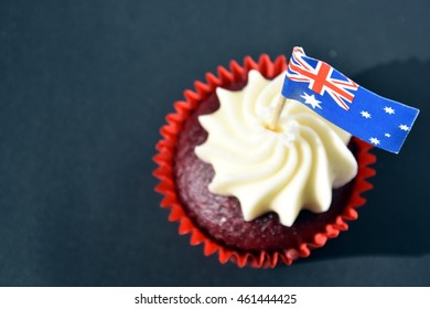 Happy Australia Day, Party Food With Red, White And Blue Cupcake And Australian Flag. Anzac Day. Celebration, Patriotism And Holidays Concept - Close Up Of Glazed Muffin Decorated With Australian Flag