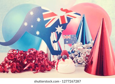 Happy Australia Day Party In Red, White And Blue Theme With Mini Pavlova And Party Decorations, With Applied Vintage Wash Filter.