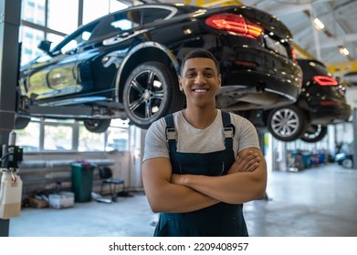 Happy Automotive Service Technician In His Workplace