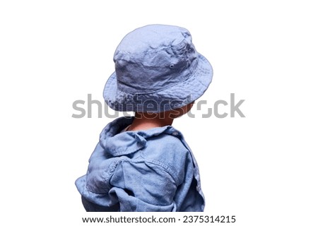 Happy baby in blue clothes - shirt and hat, isolated on white background. Kid aged about two years (one year eleven months)