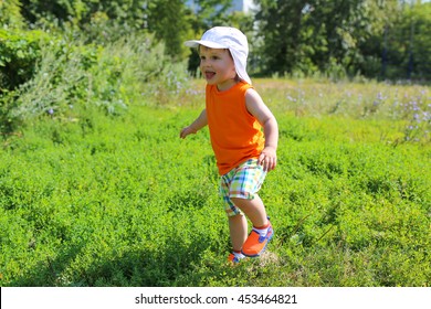 Happy Baby Boy (23 Months) Running Outdoors In Summer