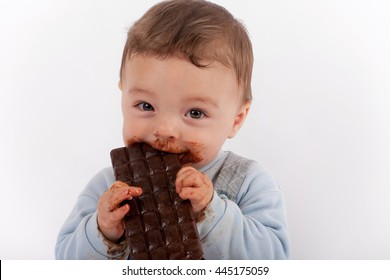 Happy Baby Boy Eating Chocolate