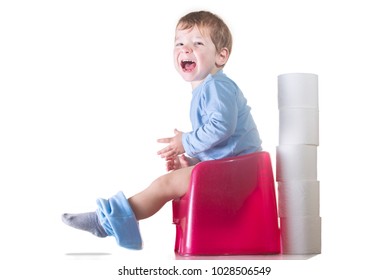 Happy Baby Boy Sitting On Chamber Pot. Potty Training Concept