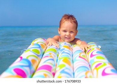 Happy Baby Boy  Swimming In The Sea