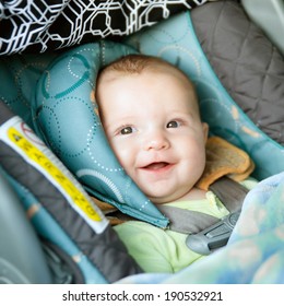 Happy Baby Buckled Into Rear-facing Car Seat