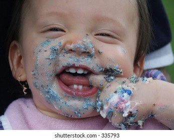 happy baby eating cake