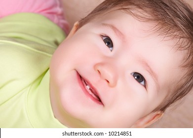 Happy Baby With First Tooth