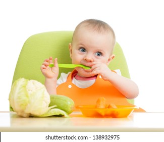 Happy Baby Girl Eating Vegetables