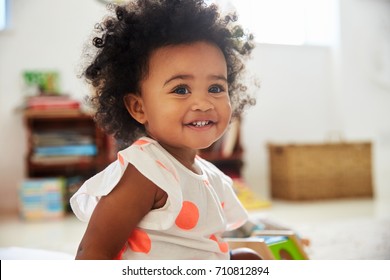 Happy Baby Girl Playing With Toys In Playroom - Shutterstock ID 710812894
