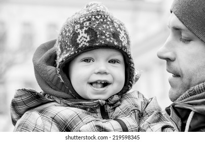 Happy Baby With His Father Outdoors In Winter ( Black And White )