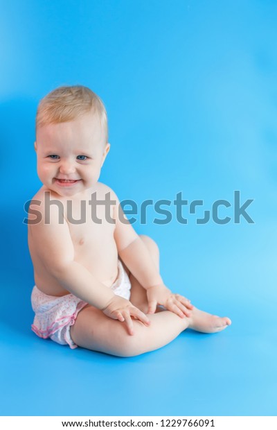 Happy Baby On Blue Background Girl Stock Photo Edit Now 1229766091