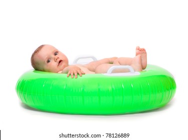 Happy Baby Playing In Rubber Dinghy.