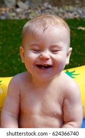 Happy Baby Smiling In A Kiddie Pool