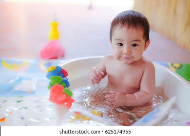 Happy Baby Taking A Bath