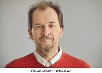 Happy Balding Senior European Man With Friendly Face Expression Looking At Camera. Head Shot Portrait Of Mature Businessman, School Teacher Or College Or University Professor On Grey Studio Background