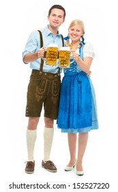 happy bavarian couple in dirndl with oktoberfest beer