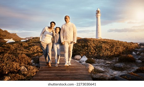 Happy, beach and girl with grandparents on boardwalk for travel vacation, bonding or sunset. Lighthouse, summer break and commitment with child and senior couple walking for support, positive or care - Powered by Shutterstock