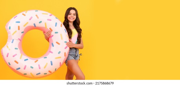 Happy Beach Teen Girl With Donut Inflatable Ring For Pool Party Fun On Summer Vacation, Summertime. Banner Of Summer Child Girl In Swimsuit, Studio Poster Header With Copy Space.