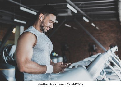 Happy Beaded Man Hearing Music In Gym