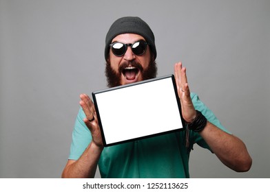 Happy bearded hipster shoinw his new graphic tablet - Powered by Shutterstock