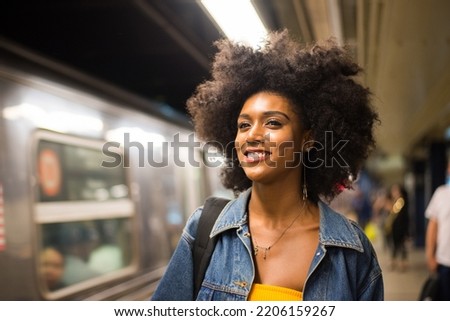 Happy and beautiful african american woman smiling. Pretty young female walking and having fun in New York city