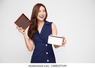 Happy beautiful Asian woman smile and opening gift box isolated on white background. Receiving gifts from lovers. New Year or Christmas concept - Powered by Shutterstock