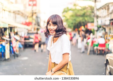 Happy and Beautiful Asian woman traveling at Khao Sarn Road in Thailand - Shutterstock ID 1384530896