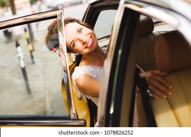  happy beautiful bride smiling in the retro car - Shutterstock ID 1078826252