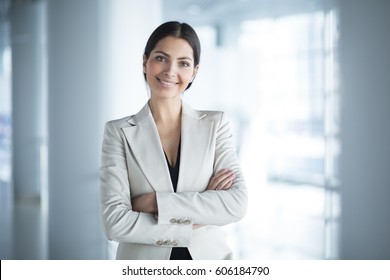 Happy Beautiful Business Woman in Office Hall