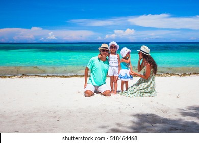 Happy Beautiful Family With Kids Walking Together On Tropical Beach During Summer Vacation