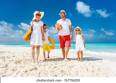 Happy Beautiful Family With Kids Walking Together On Tropical Beach During Summer Vacation