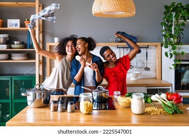 Happy beautiful hispanic south american and black women meeting indoors and having fun - Black adult females best friends spending time together, concepts about domestic life, leisure, friendship - Powered by Shutterstock