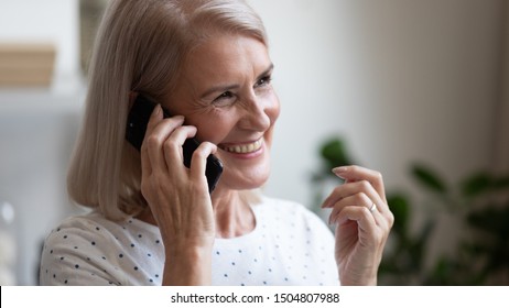 Happy Beautiful Mature Woman Making Or Answering Phone Call Close Up, Smiling Satisfied Older Female Talking On Cellphone, Having Pleasant Conversation, Chatting, Hearing Good News