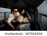 Happy beautiful newlyweds in the helicopter