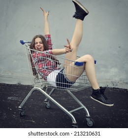 Happy Beautiful Teen Girl Driving Shopping Cart Outdoor, Image Toned And Noise Added.