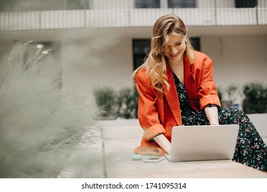 Happy and beautiful woman doing business on laptop and smiles. Young woman enjoy her work
 - Powered by Shutterstock