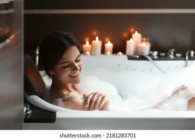 Happy Beautiful Woman Taking Bubble Bath. Romantic Atmosphere