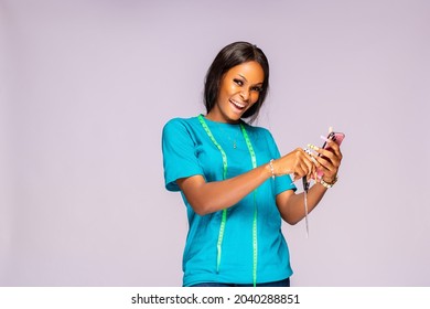 Happy Beautiful Young Black Woman Checking Her Phone And Feeling Ecstatic