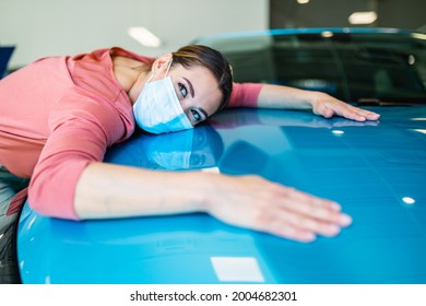 Happy Beautiful Young Woman Buying A New Car At The Car Showroom.