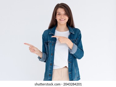 Happy Beautiful Young Woman Showing Way With Fingers