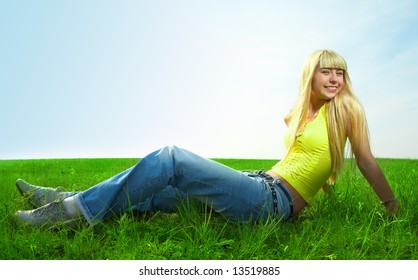 happy beauty young woman jump in field with green grass