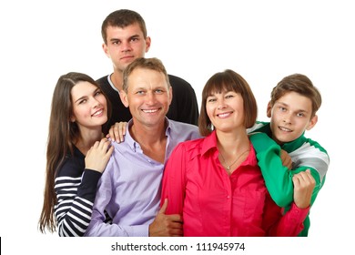 Happy Big Caucasian Family Having Fun And Smiling Over White Background. Mother, Father And Children - Daughter With Her Husband And Son Teenager