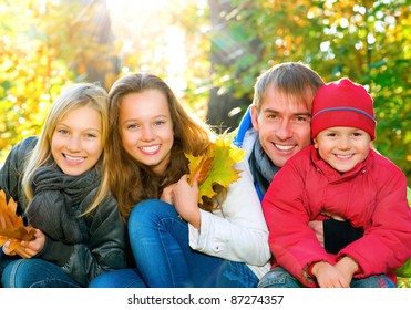 Happy Big Family With Kids Walking in Autumn Park.