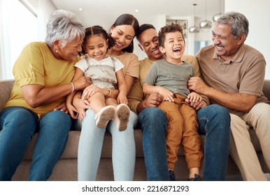 Happy, big family and quality time bonding of children, parents and grandparents together on a sofa. Laughing kids having fun with mom, dad and grandparent on a home living room couch with happiness - Powered by Shutterstock