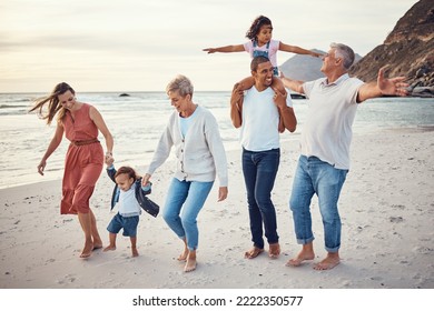 Happy big family, vacation and beach walk for quality bonding time together in the outdoors. Mother, father and grandparents with children playing with smile in happiness for family trip by the ocean - Powered by Shutterstock