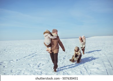 Happy Big Family Walk On A Field In Winter Sunny Day