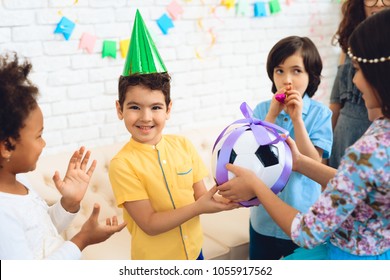 Happy Birthday Boy Receives Football Ball As Birthday Gift. Happy Birthday Party. Little Children On Birthday Celebrations.