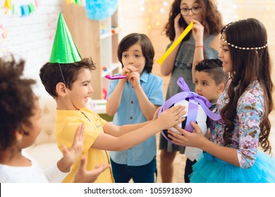 Happy Birthday Boy Receives Football Ball As Birthday Gift. Happy Birthday Party. Little Children On Birthday Celebrations.