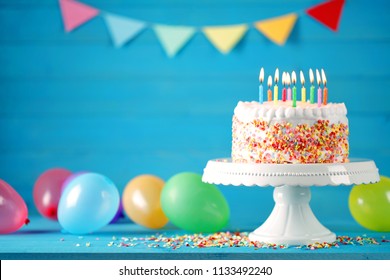 Happy birthday cake with colorful balloons decoration. Birthday card.